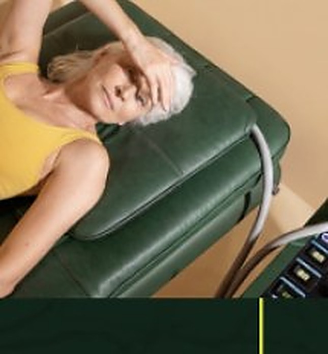 Woman resting on a green treatment chair